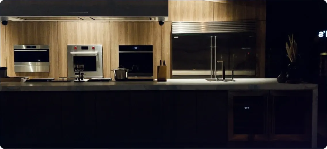 Modern restaurant kitchen with professional appliances and ambient lighting