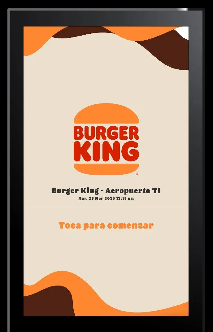 Burger King kiosk welcome screen for the Aeropuerto T1 store, with a prompt to tap to start