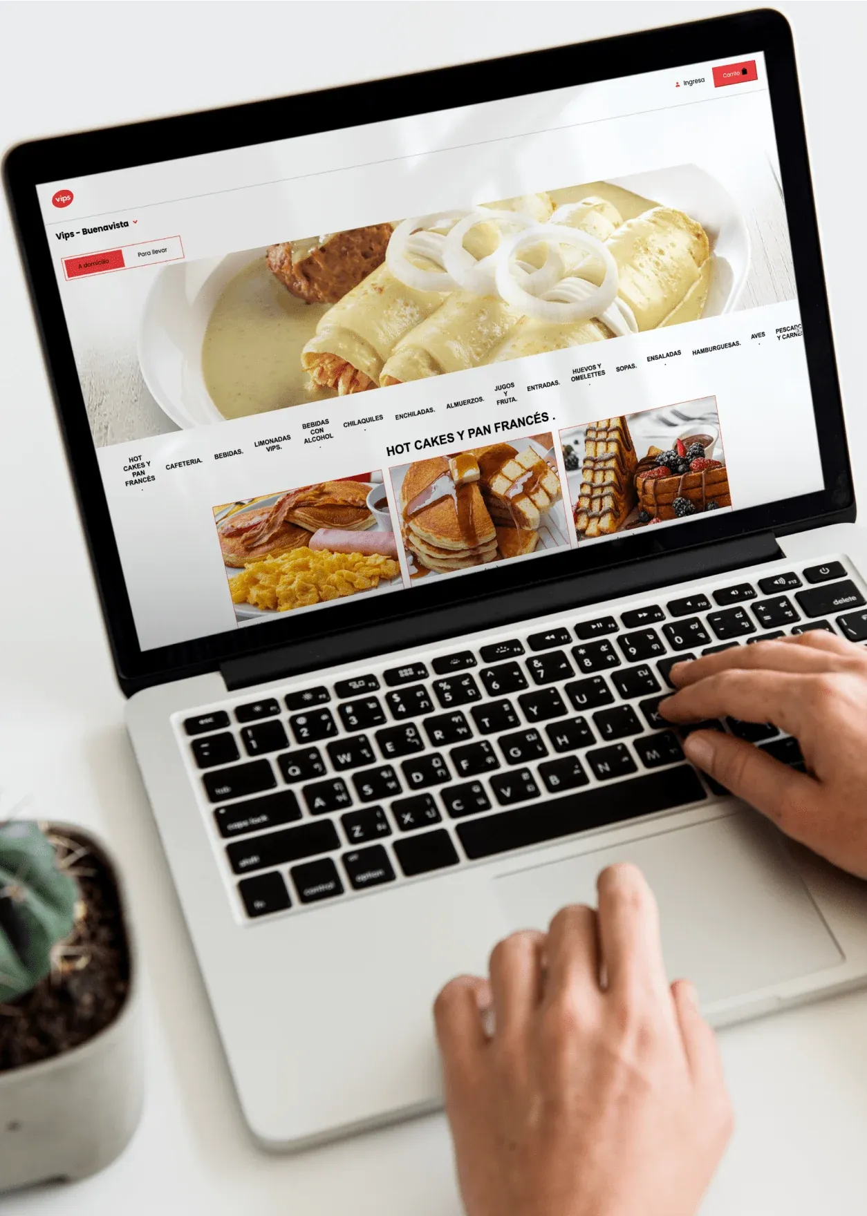 A laptop showing the Vips Buenavista store page, with delivery and takeout options and the hot cakes and French toast menu section